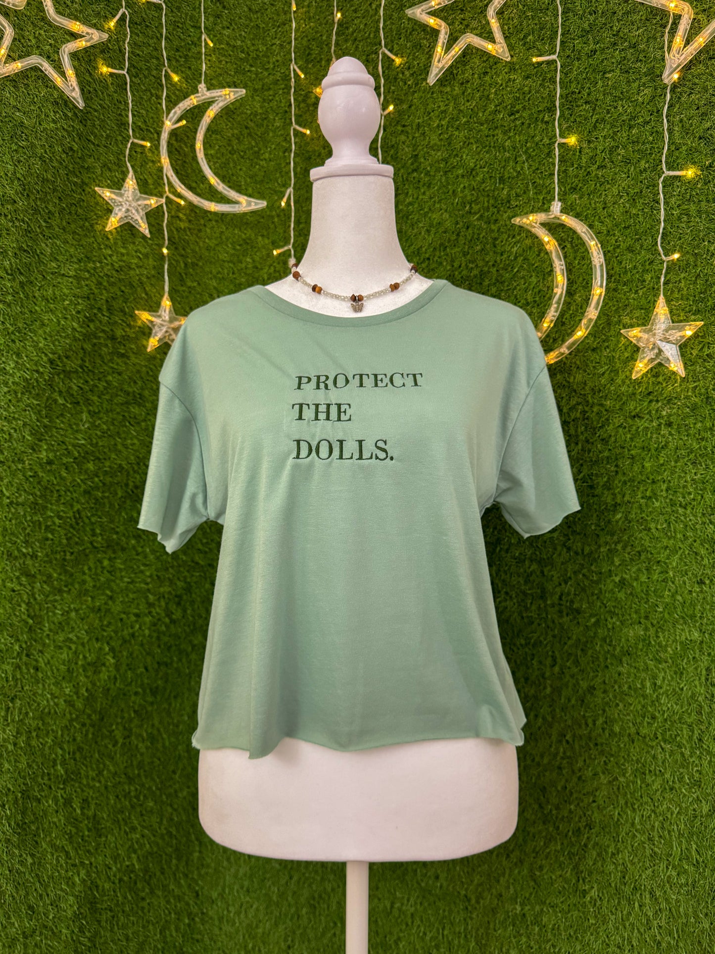 Protect the Dolls Green Cropped Tee L